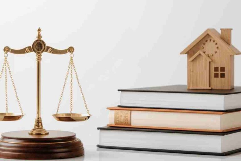 Scales of justice, law books, and a model house.